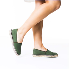Load image into Gallery viewer, Poor green espadrilles with white dress and bare legs
